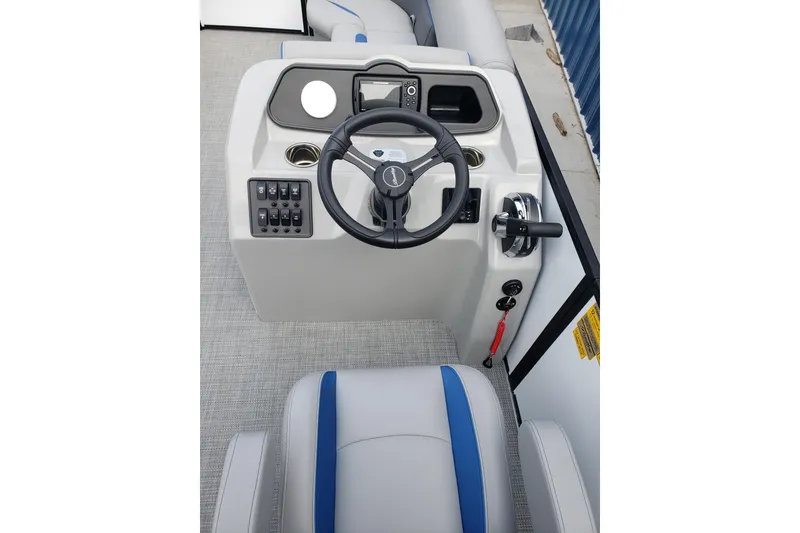Slide: The Image of 2026 Bentley Pontoons 223 Bolt dashboard with steering wheel and control panel. - 14