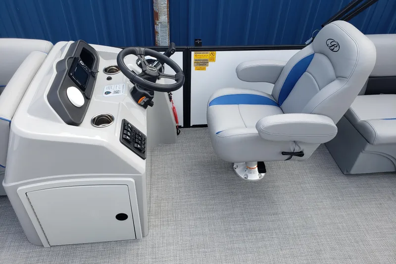Slide: The Image of 2026 Bentley Pontoons 223 Bolt helm with steering wheel and captain's chair. - 15