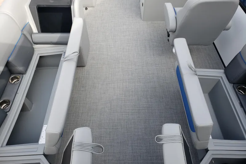 Slide: The Image of 2026 Bentley Pontoons 223 Bolt interior with gray seating and storage compartments. - 17
