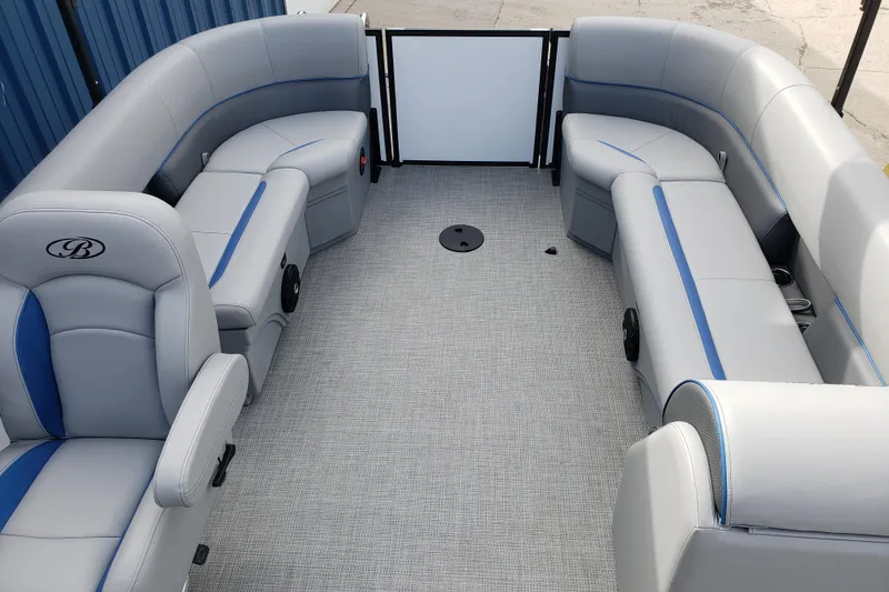 Slide: The Image of 2026 Bentley Pontoons 223 Bolt interior with gray and blue seating, spacious layout. - 18