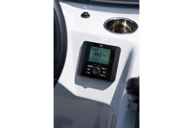 Slide: The Image of 2025 Bentley Pontoons 223 Bolt interior with luxurious seating on a calm lake. - 3