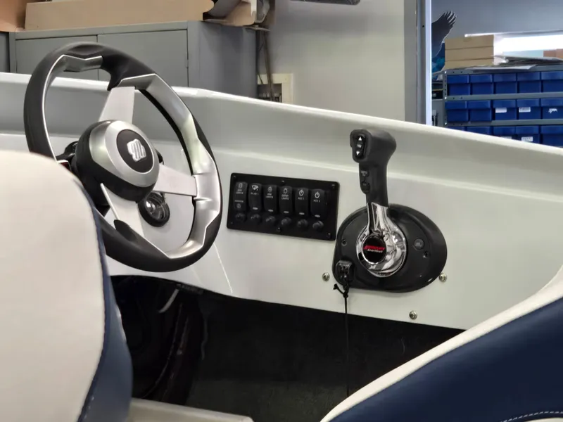 Slide: The Image of Boat cockpit with steering wheel and control panel, Activator 22, 1991 model. - 13