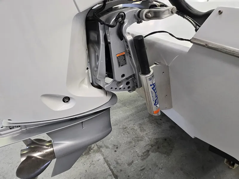 Slide: The Image of Close-up of a 1991 Activator 22 boat engine and propeller system. - 17