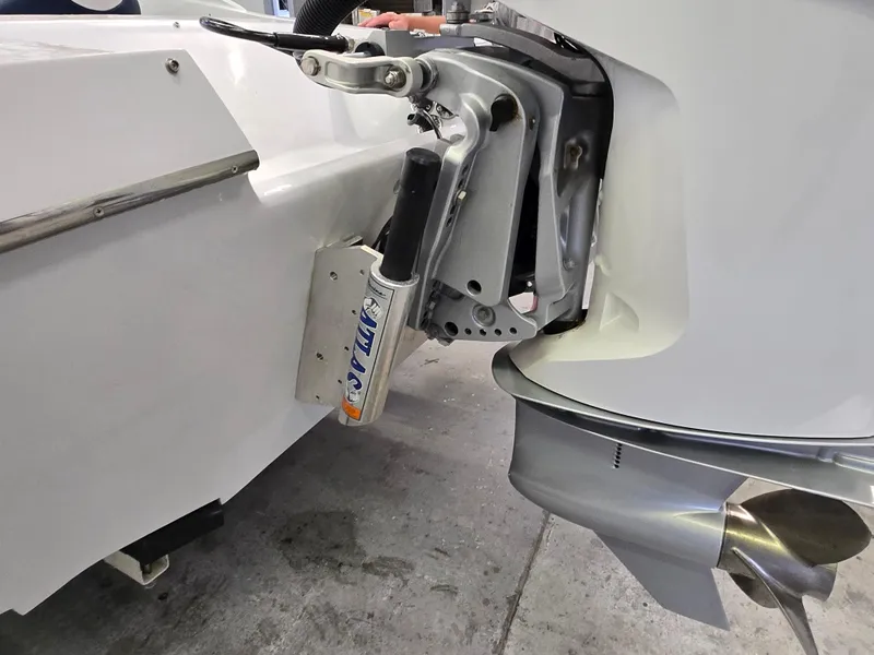 Slide: The Image of Outboard motor and propeller on a 1991 Activator 22 boat. - 18