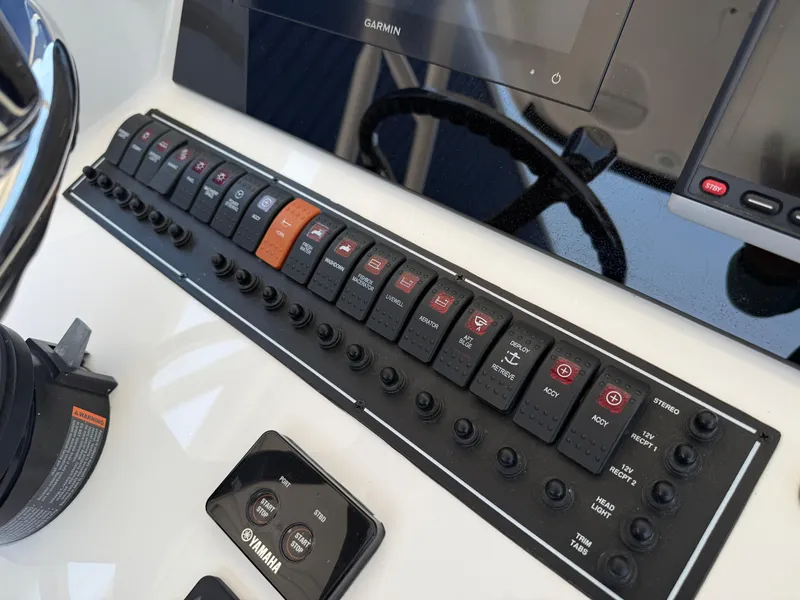 Slide: The Image of Control panel of a 2015 Pursuit S 280 Sport boat with Yamaha controls. - 18