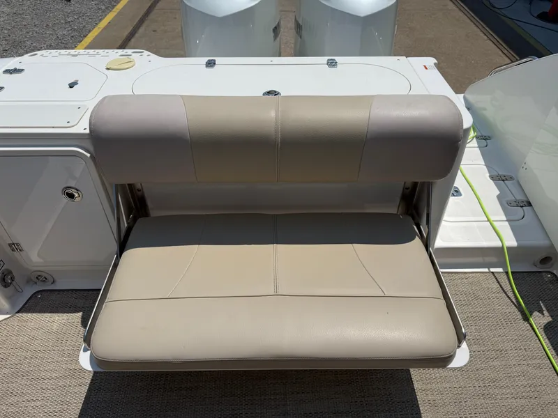Slide: The Image of 2015 Pursuit S 280 Sport boat seat, beige upholstery, outdoor setting. - 22