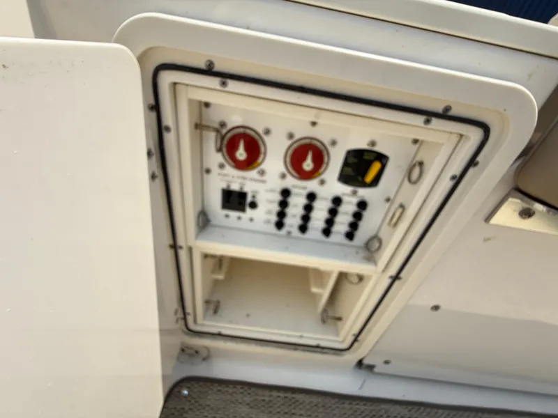 Slide: The Image of Control panel on a 2015 Pursuit S 280 Sport boat. - 26