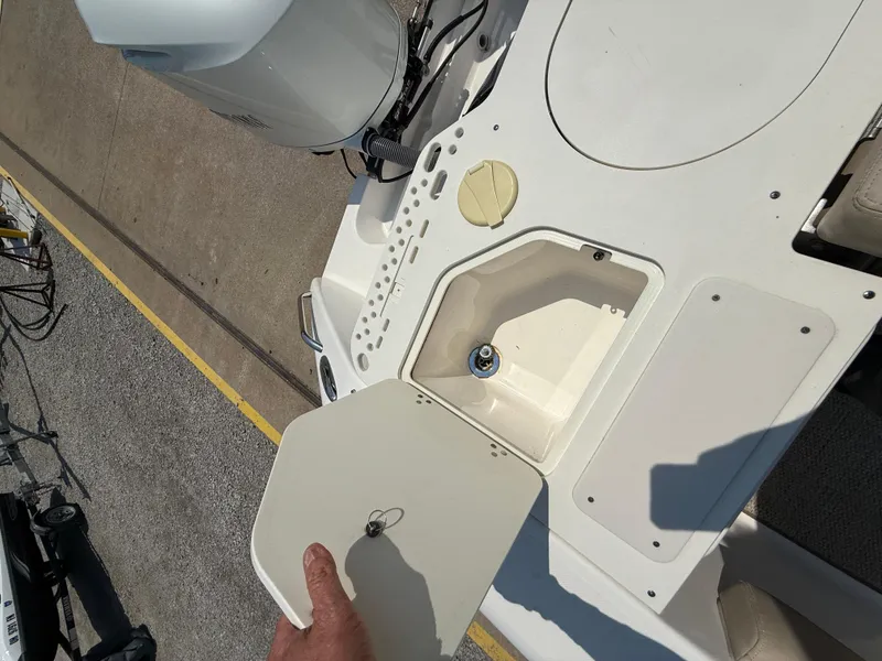 Slide: The Image of 2015 Pursuit S 280 Sport boat deck with open storage compartment. - 28