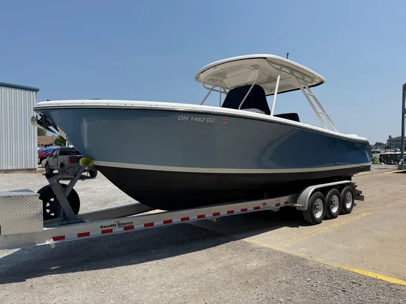 Slide: The Image of 2015 Pursuit S 280 Sport boat on a trailer in a parking lot. - 3