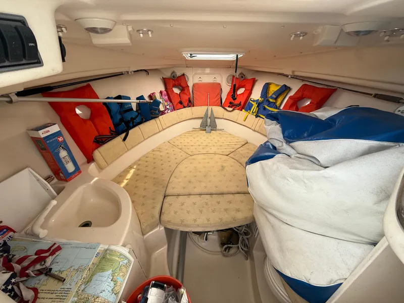Slide: The Image of Interior of 2005 Wellcraft 252 Coastal boat with life jackets and seating area. - 15