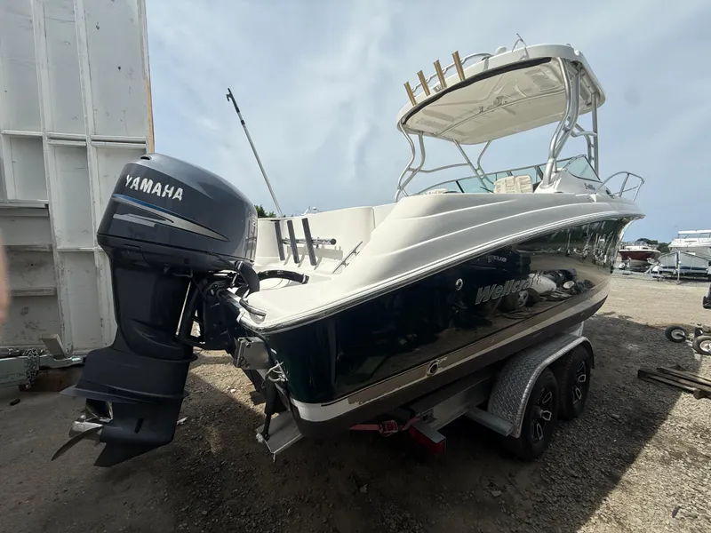 Slide: The Image of 2005 Wellcraft 252 Coastal boat with Yamaha outboard motor on trailer. - 3
