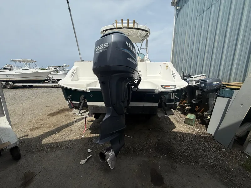 Slide: The Image of 2005 Wellcraft 252 Coastal boat with Yamaha 225 engine, parked outdoors. - 4