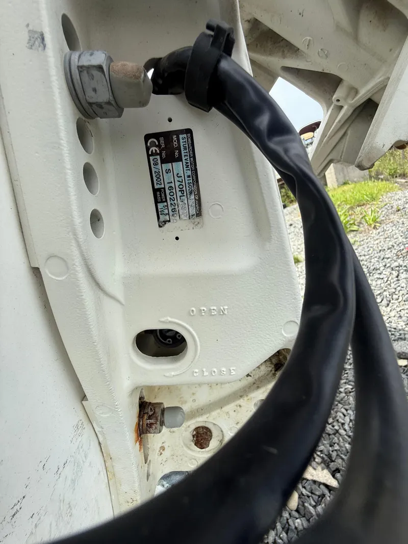 Slide: The Image of Close-up of Maritime Skiff 1890, 2002 model, showing a cable and labeled panel. - 12