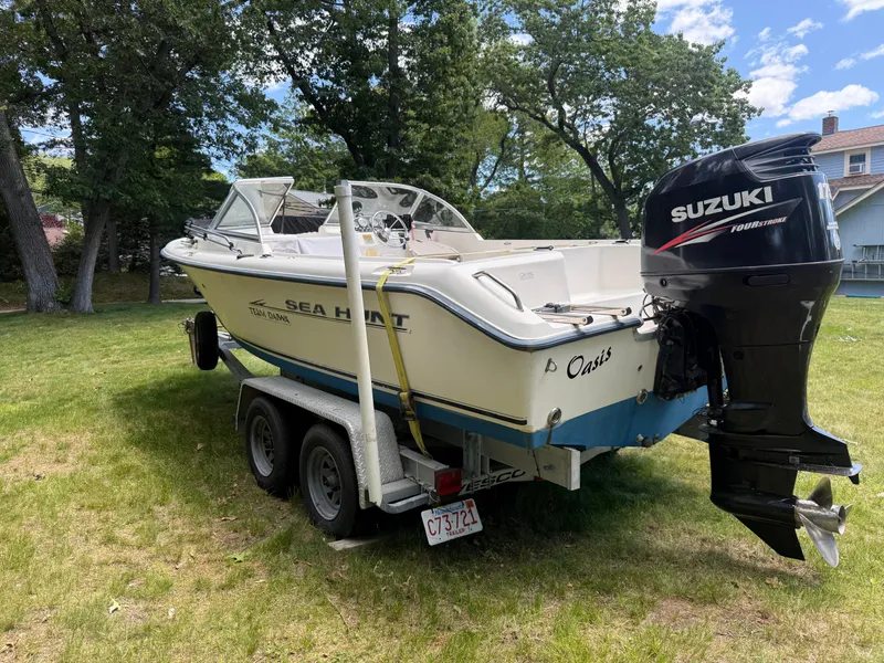 Slide: The Image of 2005 Sea Hunt Escape 200 boat on trailer with Suzuki outboard motor. - 5