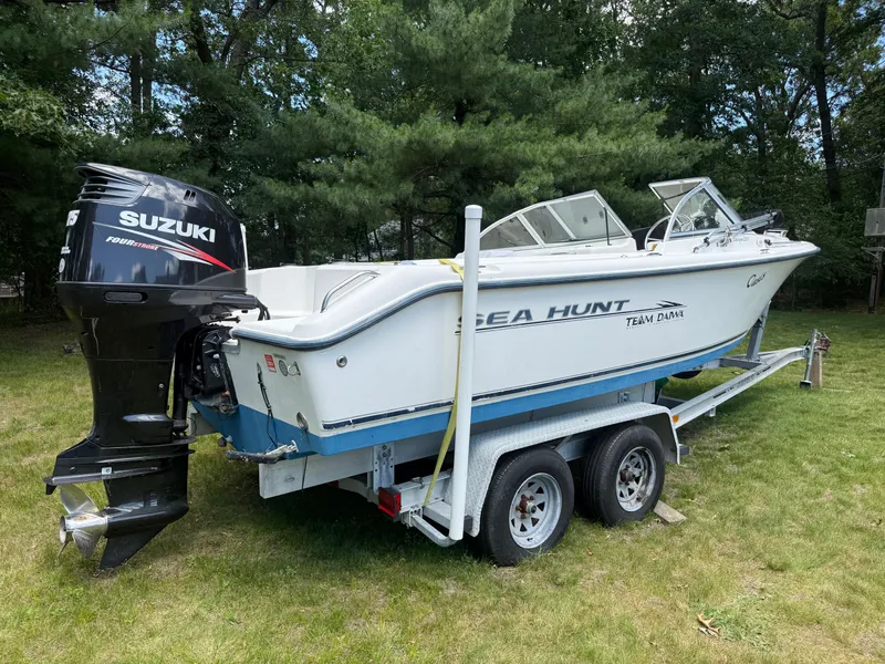 Slide: The Image of 2005 Sea Hunt Escape 200 boat on trailer with Suzuki outboard motor. - 6
