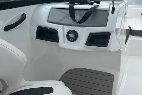 Slide: The Image of 2023 Tahoe 185 S boat interior with sleek dashboard and seating. - 10