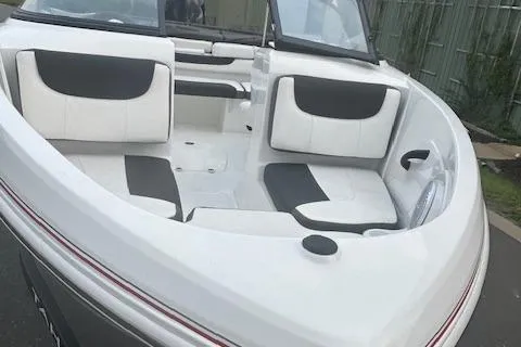 Slide: The Image of 2023 Tahoe 185 S boat interior with white and black seating. - 5
