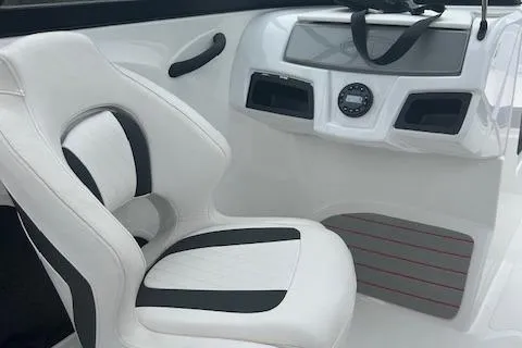 Slide: The Image of 2023 Tahoe 185 S boat interior with white and black seating and modern dashboard. - 8