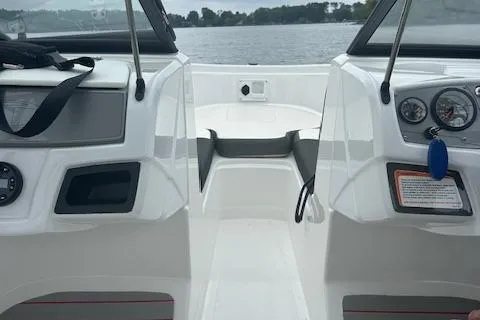 Slide: The Image of 2023 Tahoe 185 S boat interior with dashboard and lake view. - 9