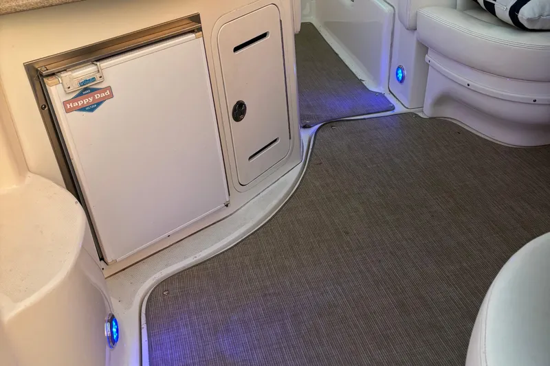 Slide: The Image of Interior of 2004 Sea Ray 320 Sundancer with fridge and blue LED lighting. - 30