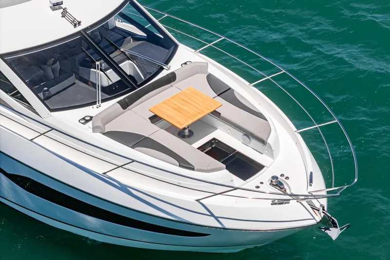 Slide: The Image of 2022 Sunseeker Manhattan 55 yacht with sleek design and spacious deck seating. - 10