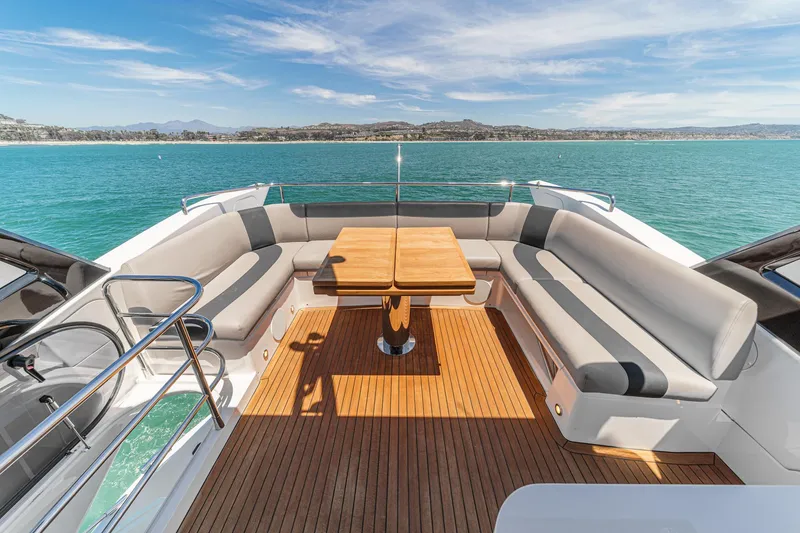 Slide: The Image of Luxurious 2022 Sunseeker Manhattan 55 yacht deck with seating and ocean view. - 16