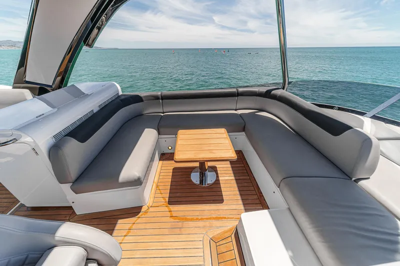 Slide: The Image of Luxurious Sunseeker Manhattan 55 yacht deck with elegant seating, ocean view, 2022 model. - 22
