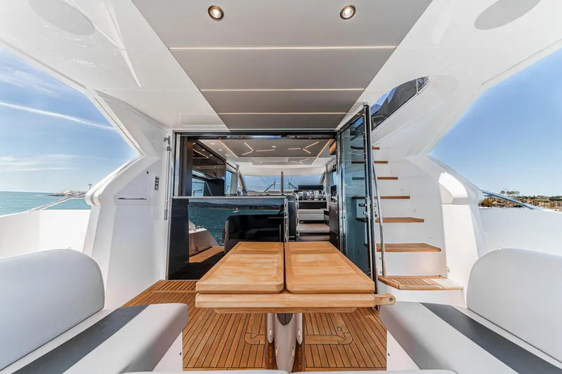 Slide: The Image of Luxurious Sunseeker Manhattan 55 yacht interior, featuring elegant wood finishes and modern design, 2022 model. - 32
