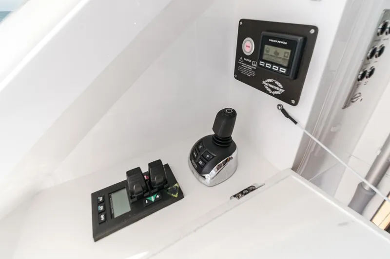 Slide: The Image of Control panel of 2022 Sunseeker Manhattan 55 yacht, featuring joystick and digital display. - 34