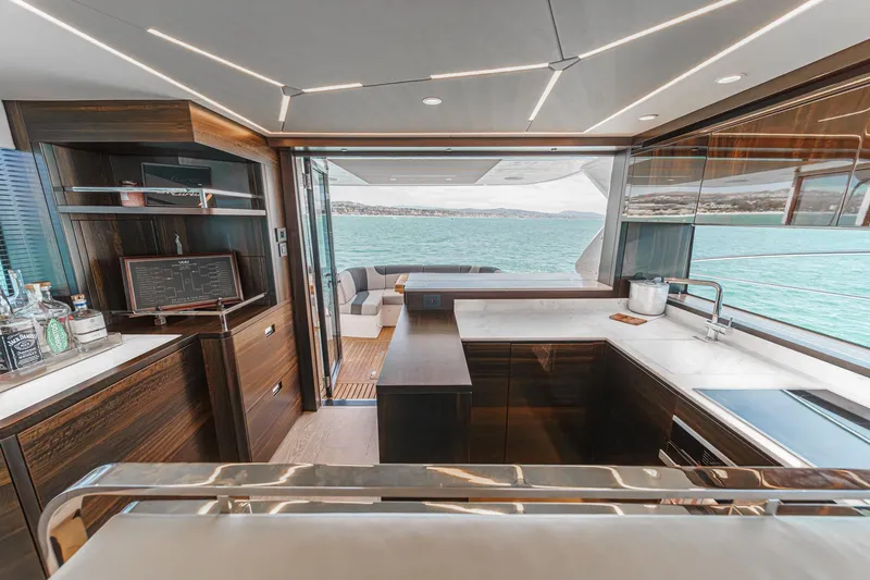 Slide: The Image of Luxurious interior of 2022 Sunseeker Manhattan 55 yacht with modern kitchen and ocean view. - 37