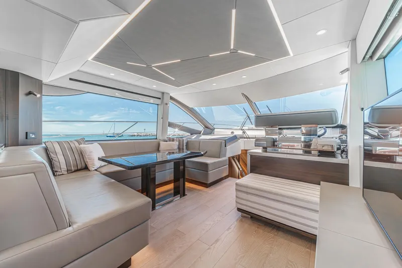 Slide: The Image of Luxurious interior of 2022 Sunseeker Manhattan 55 yacht with modern seating and panoramic windows. - 41