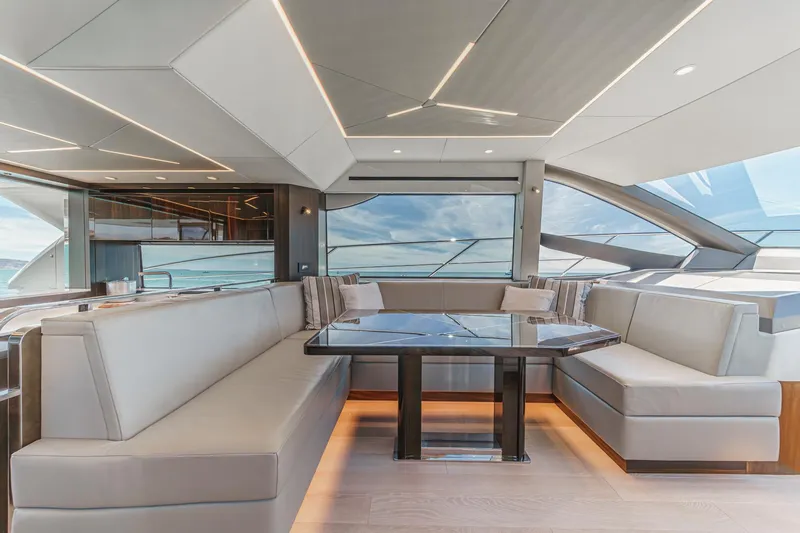 Slide: The Image of Luxurious interior of 2022 Sunseeker Manhattan 55 yacht with elegant seating and panoramic windows. - 45