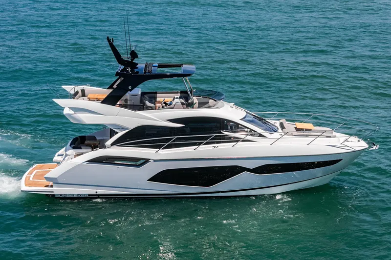 Slide: The Image of 2022 Sunseeker Manhattan 55 yacht cruising on open water. - 5