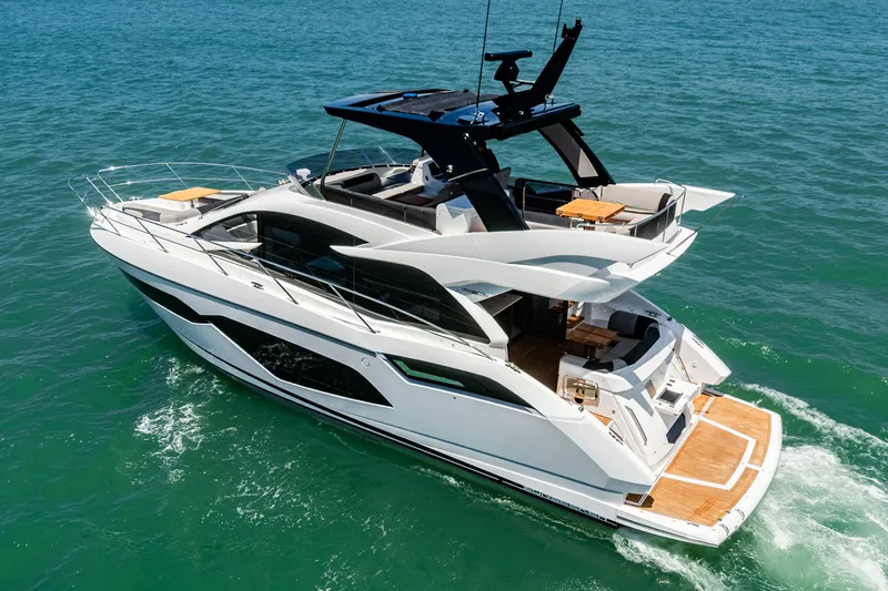 Slide: The Image of 2022 Sunseeker Manhattan 55 yacht cruising on open water. - 7