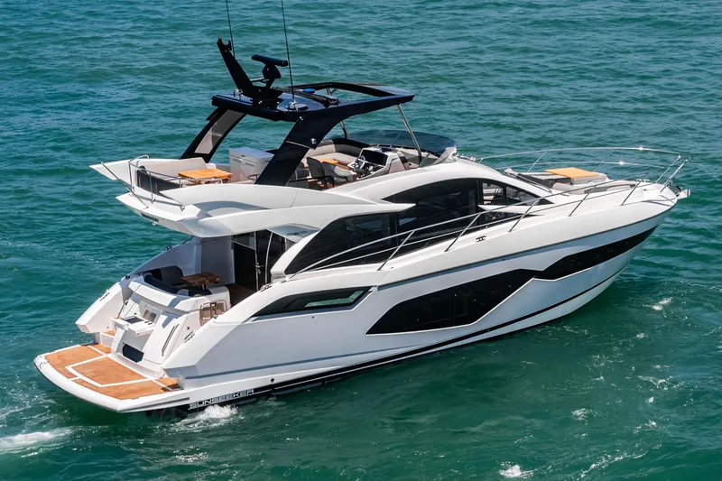Slide: The Image of 2022 Sunseeker Manhattan 55 yacht cruising on open water, showcasing sleek design and luxury features. - 8