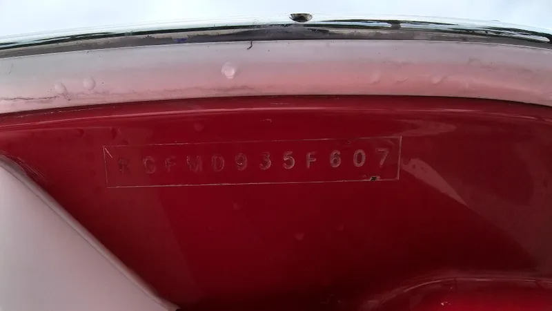 Slide: The Image of 2007 Monterey 214FS Montura boat hull identification number (HIN) on red surface. - 13