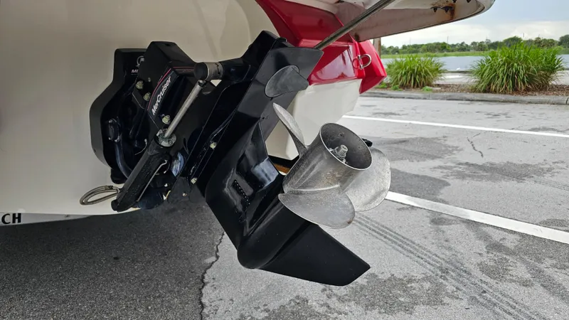 Slide: The Image of 2007 Monterey 214FS Montura boat with MerCruiser outdrive and propeller, parked near a lake. - 14