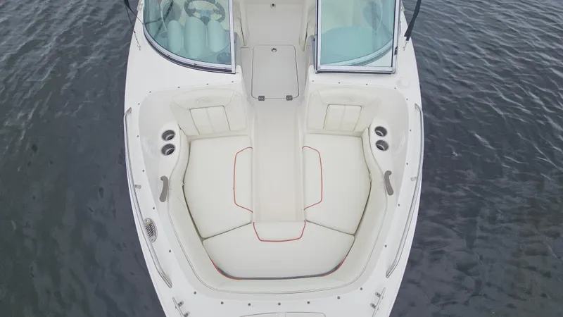 Slide: The Image of 2007 Monterey 214FS Montura boat with white seating, viewed from above on water. - 17