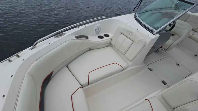 Slide: The Image of 2007 Monterey 214FS Montura boat interior with white seating and cup holders. - 20