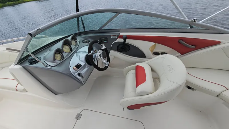 Slide: The Image of 2007 Monterey 214FS Montura boat interior with steering wheel and dashboard controls. - 35