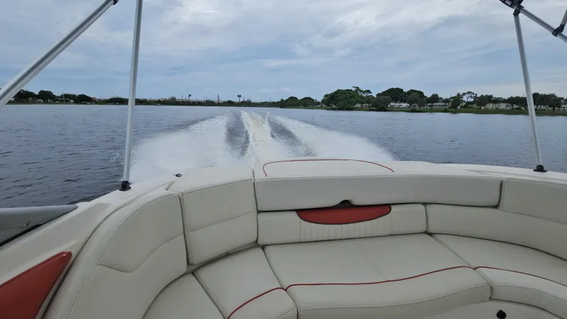 Slide: The Image of 2007 Monterey 214FS Montura boat cruising on a calm lake with wake trails. - 41