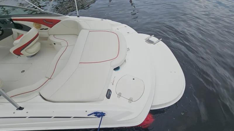 Slide: The Image of 2007 Monterey 214FS Montura boat with white and red interior on calm water. - 42