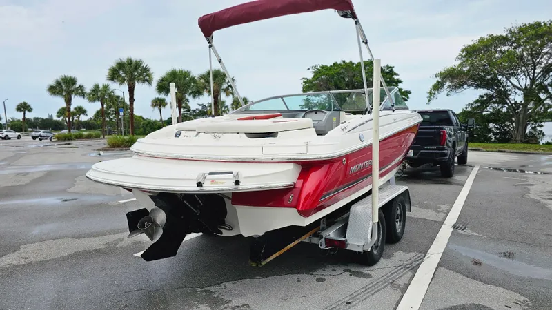 Slide: The Image of 2007 Monterey 214FS Montura boat on trailer, parked near palm trees. - 5