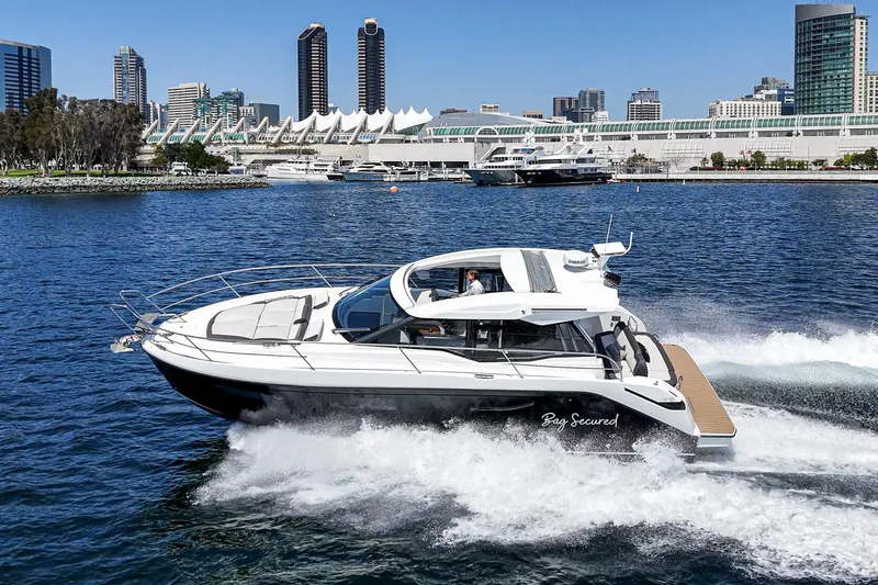 Slide: The Image of 2023 Bavaria SR36 yacht cruising in urban waterfront setting. - 13