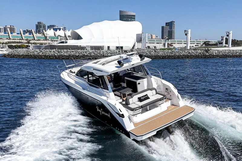 Slide: The Image of 2023 Bavaria SR36 yacht cruising near modern waterfront cityscape. - 17