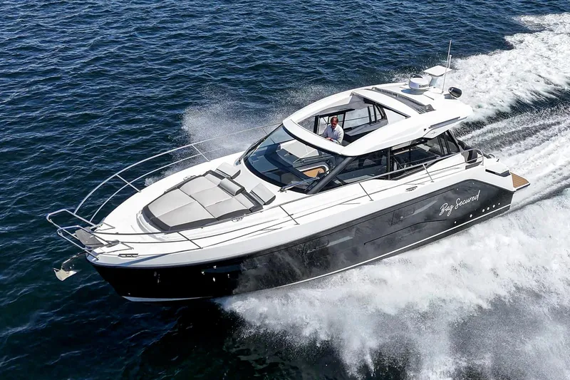 Slide: The Image of 2023 Bavaria SR36 yacht cruising on open water, showcasing sleek design and performance. - 2