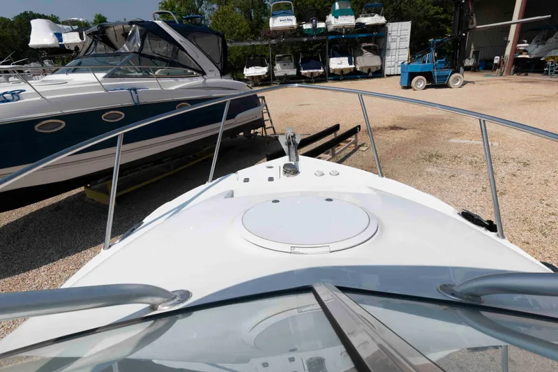 Slide: The Image of 2008 Polar 2300 Walkaround boat in storage yard with other vessels. - 10