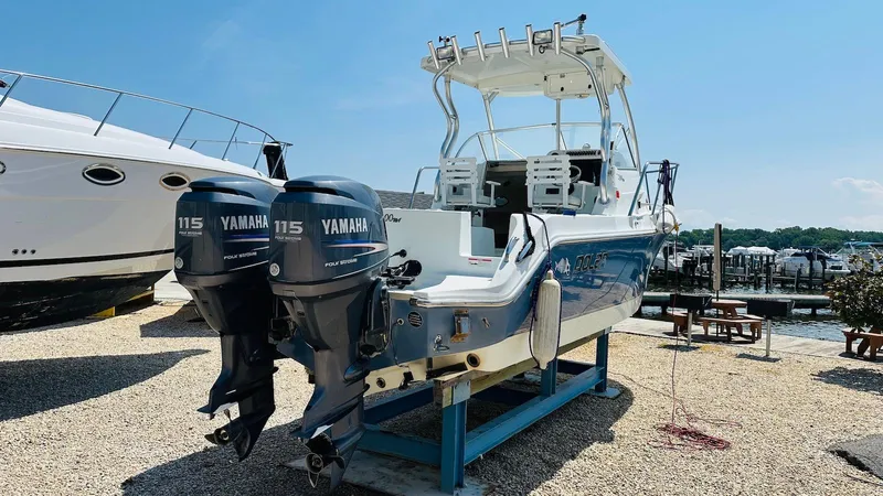 Slide: The Image of 2008 Polar 2300 Walkaround boat with twin Yamaha 115 engines on display. - 5