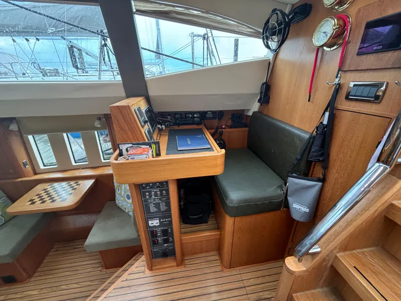Slide: The Image of Interior of 2014 Southerly 535 yacht with navigation station and seating area. - 11