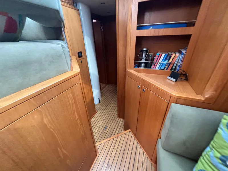 Slide: The Image of Interior of 2014 Southerly 535 yacht with wooden cabinetry and bookshelves. - 16